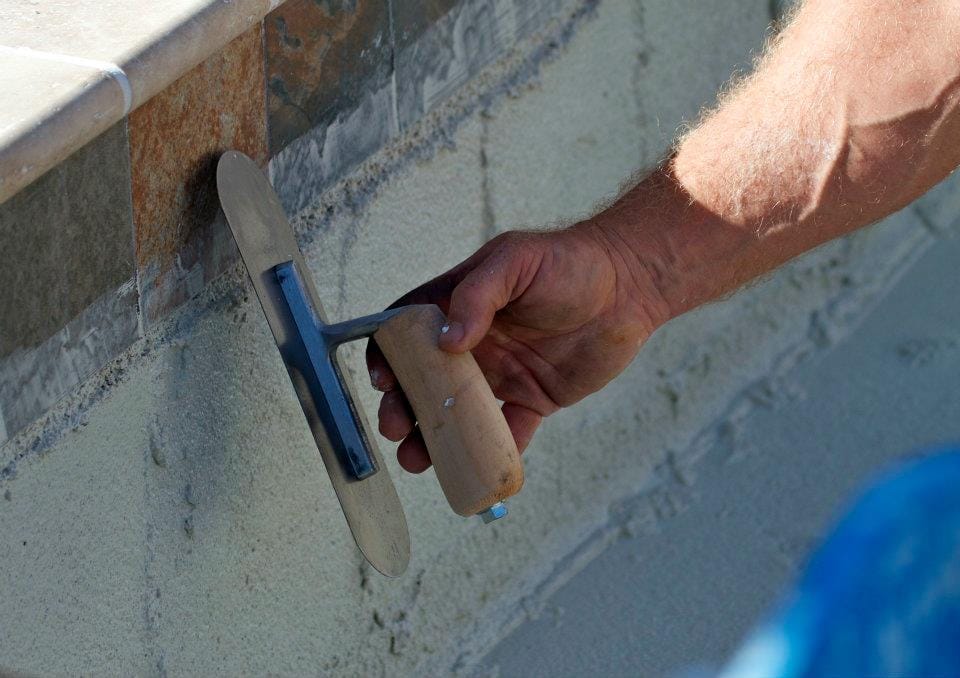 A freshly plastered pool surface showcasing smooth, white plaster, highlighting pool plastering Jacksonville FL.