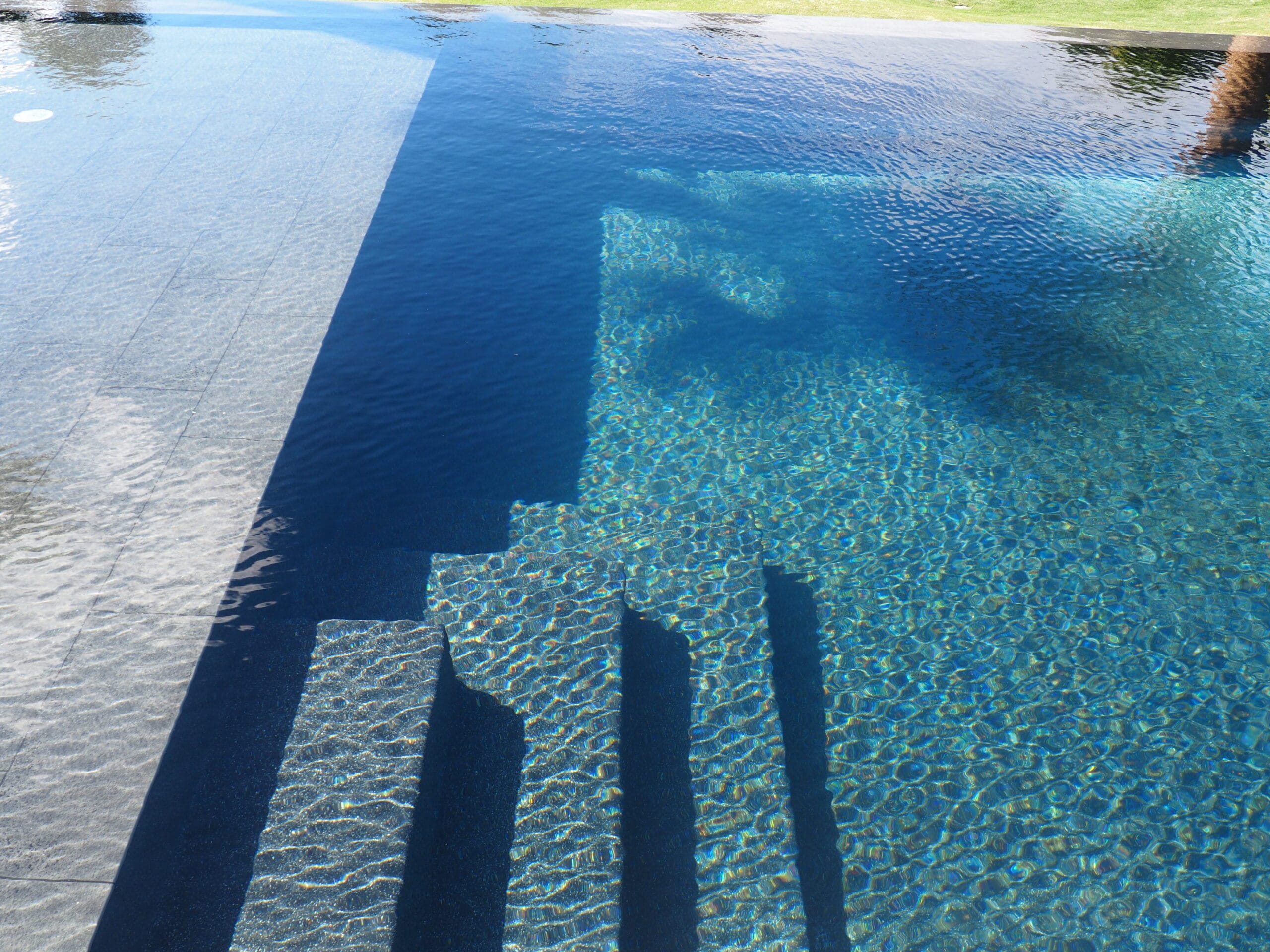 pool plastering Jacksonville FL - Close-up of a smooth, freshly plastered pool surface, showcasing quality pool plastering in