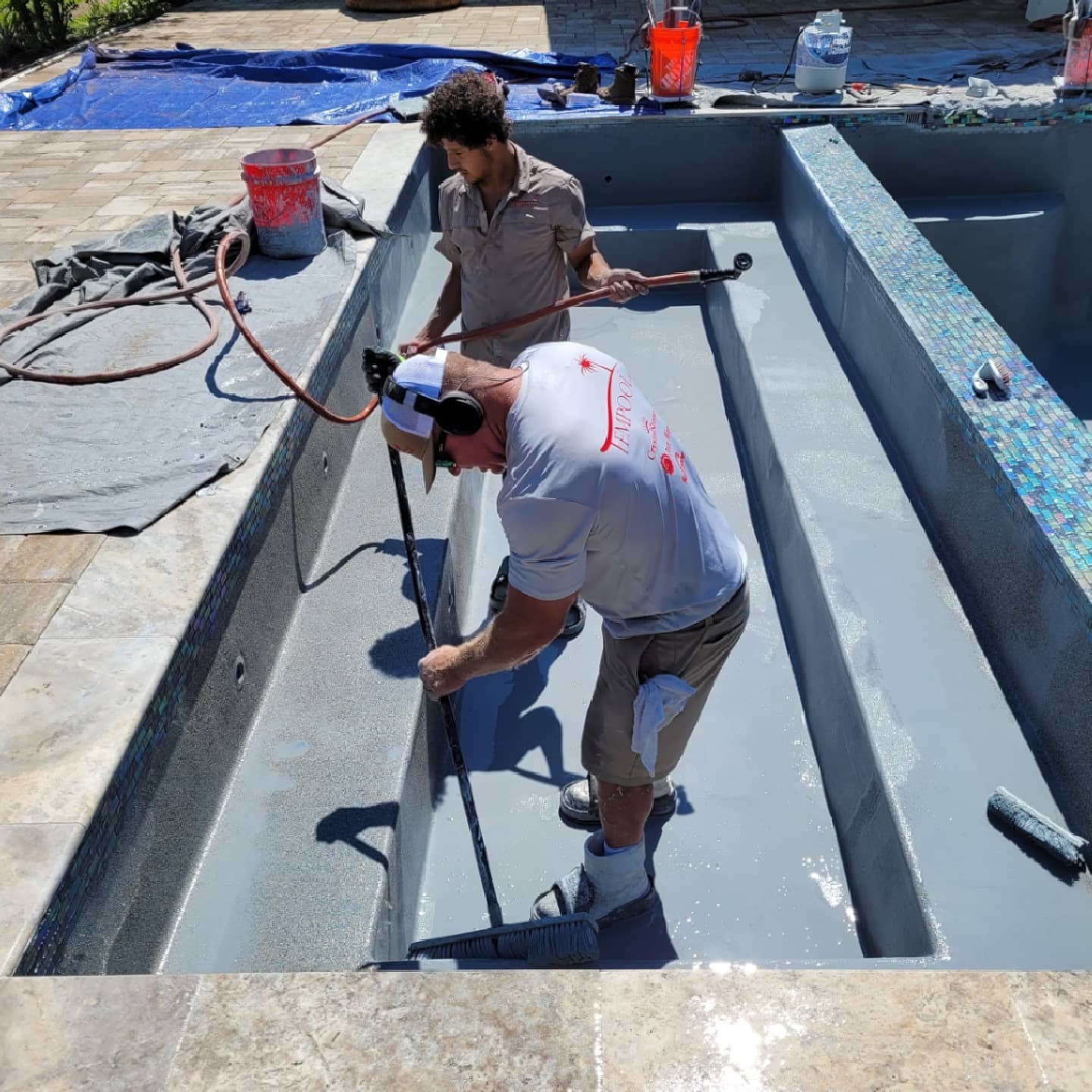 pool plastering Jacksonville FL - A freshly plastered pool surface in Jacksonville, FL, showcasing smooth, white plaster read