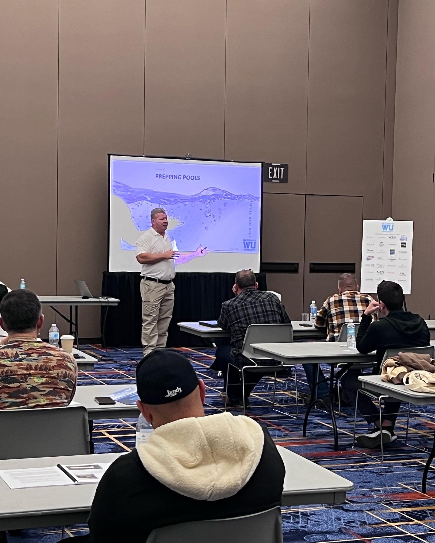 pool plaster training Jacksonville FL - A trainer demonstrating pool plaster techniques to students in Jacksonville FL, showc
