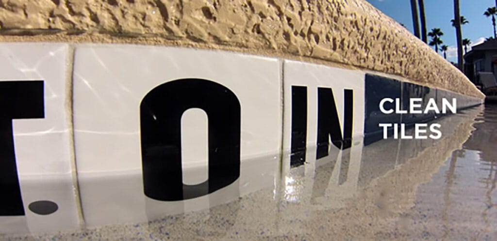 Close-up of clean pool tiles with water reflections, demonstrating effective methods on how to clean pool tiles.