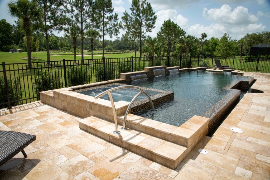 A luxurious pool featuring the Black Pearl pool finish, showcasing deep, shimmering black tones and elegant water reflections