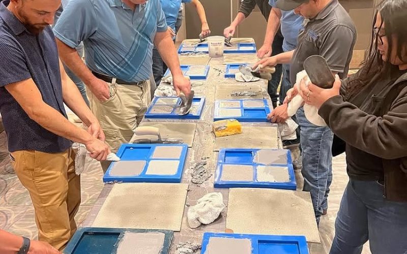 pool plaster training Jacksonville FL - A worker applying pool plaster during training in Jacksonville FL, showcasing hands-o