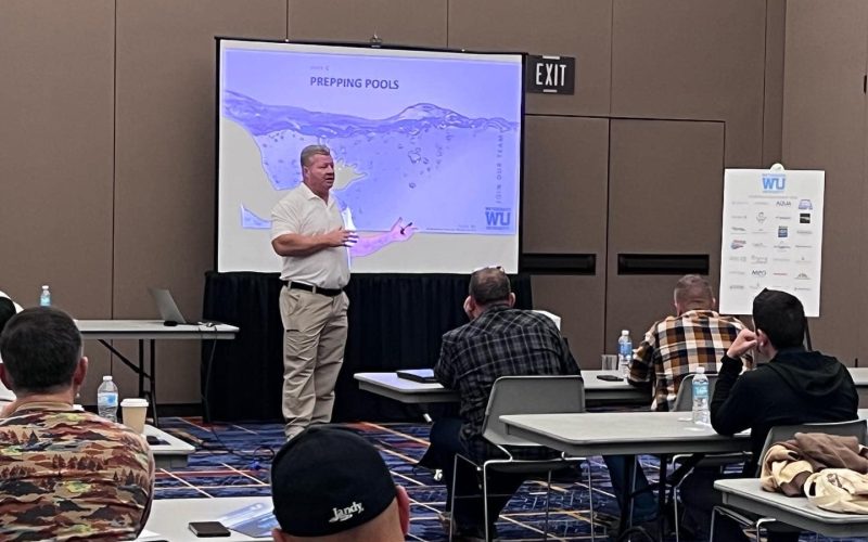 pool plaster training Jacksonville FL - A trainer demonstrating pool plaster techniques to students in Jacksonville FL, showc
