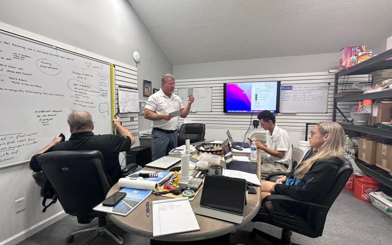 pool plaster training Jacksonville FL - A worker applying pool plaster during training in Jacksonville, FL, showcasing hands-