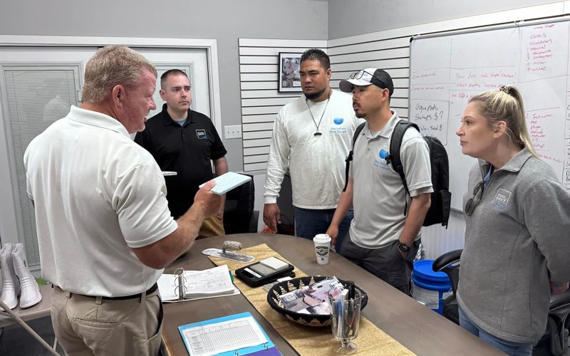 pool plaster training Jacksonville FL - A trainer demonstrates pool plaster techniques during a session in Jacksonville, FL,