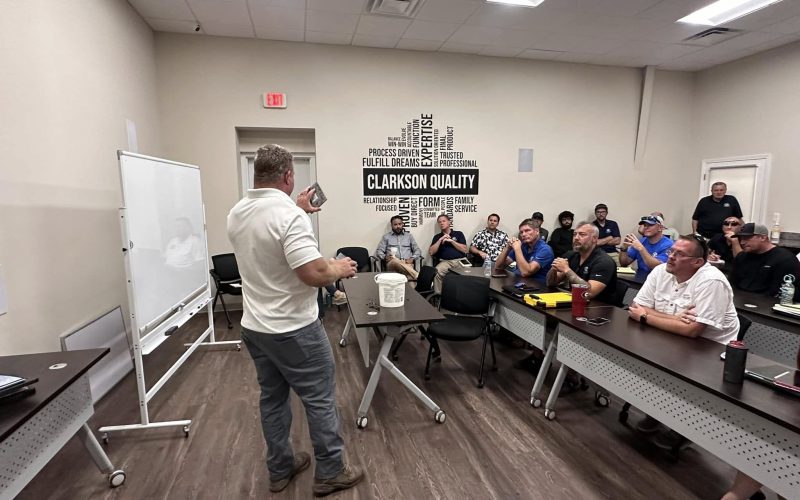 pool plaster training Jacksonville FL - A skilled worker applying pool plaster during training in Jacksonville, FL, showcasin