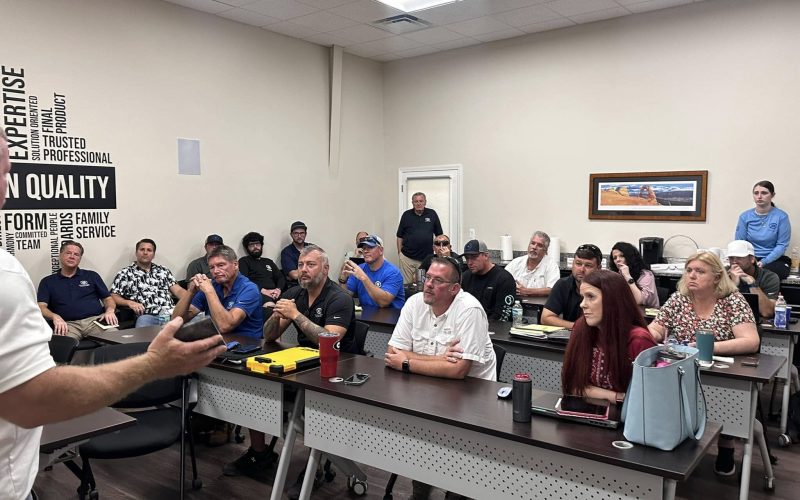 pool plaster training Jacksonville FL - A trainer demonstrating pool plaster techniques to a group of trainees in Jacksonvill