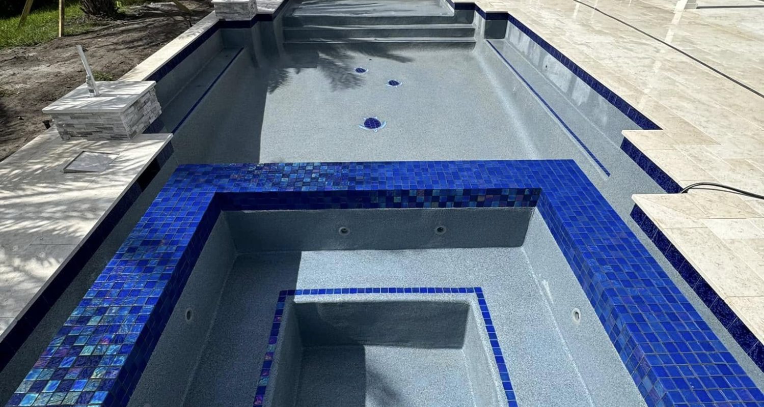 pool plaster product development Jacksonville FL - Close-up of a smooth pool plaster surface, showcasing the quality of pool