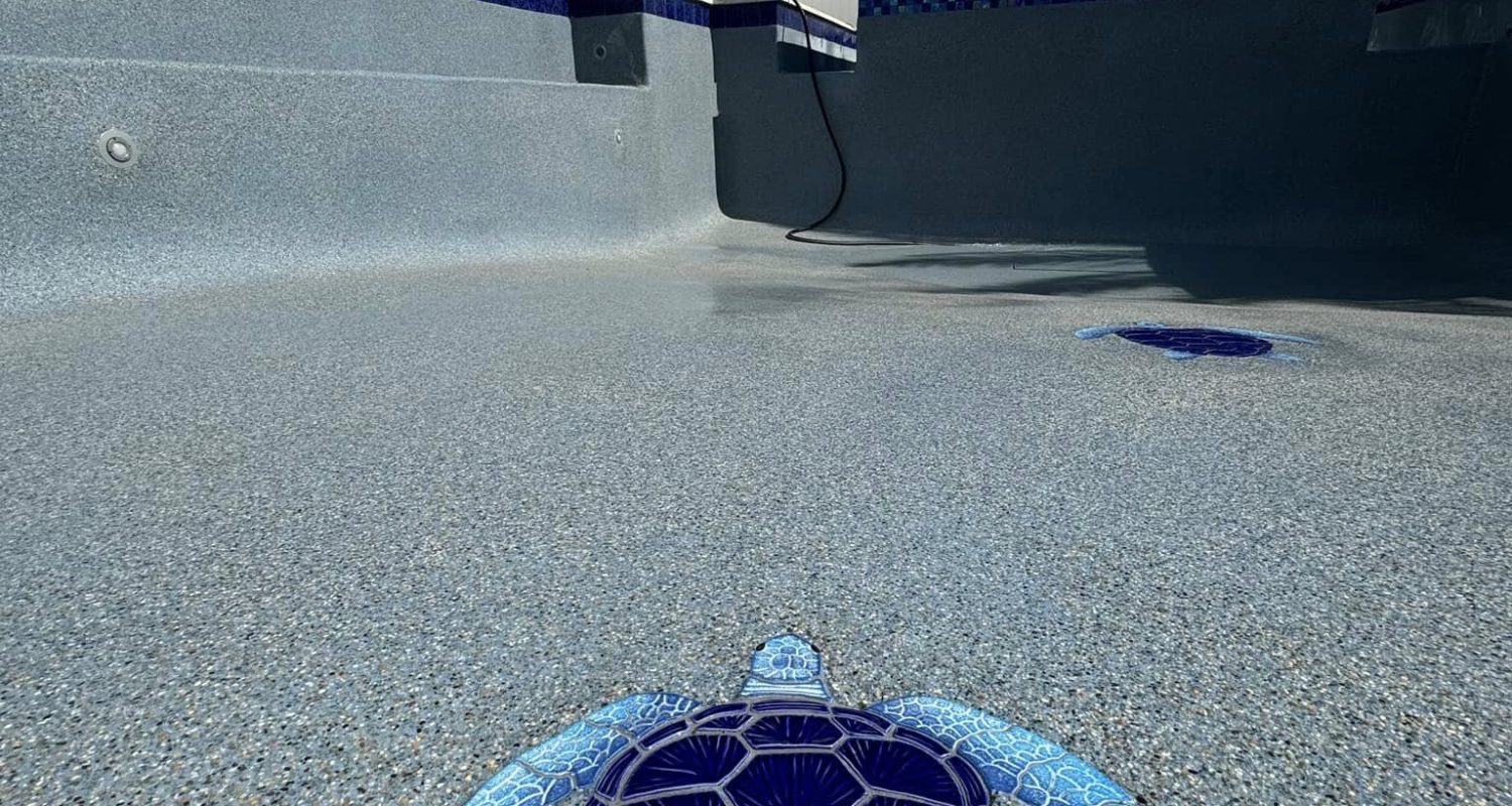 pool plaster product development Jacksonville FL - A close-up view of a smooth, freshly applied pool plaster showcasing its t